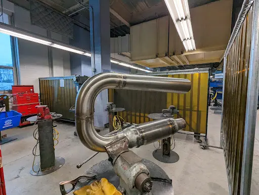 Valveless pulsejet in a workshop held by bench vice